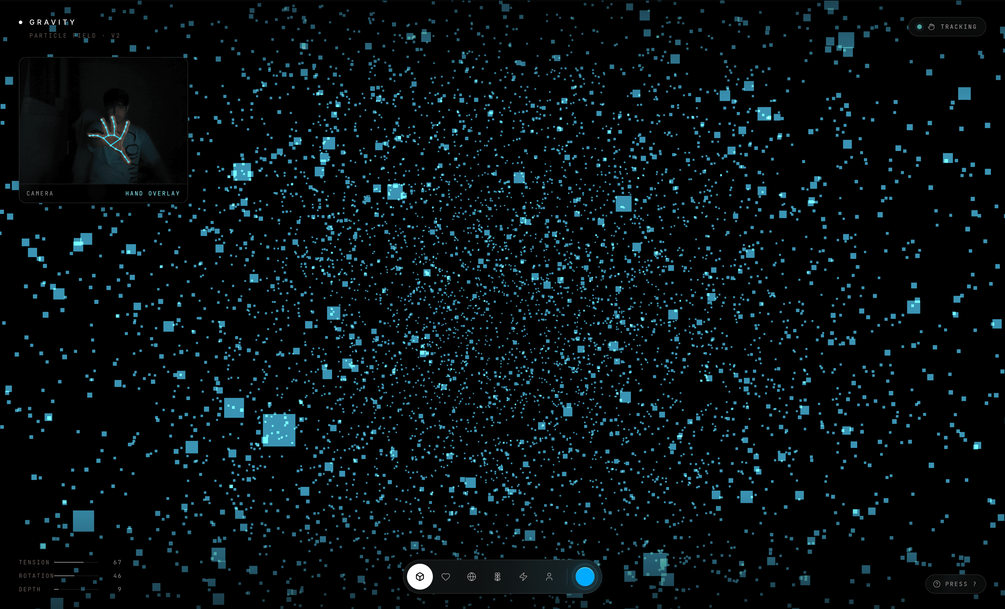 Gravity app with the particle field expanded into a wide cyan cloud controlled by an open hand.